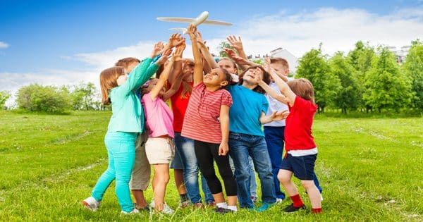 blog picture of children playing with toy plane